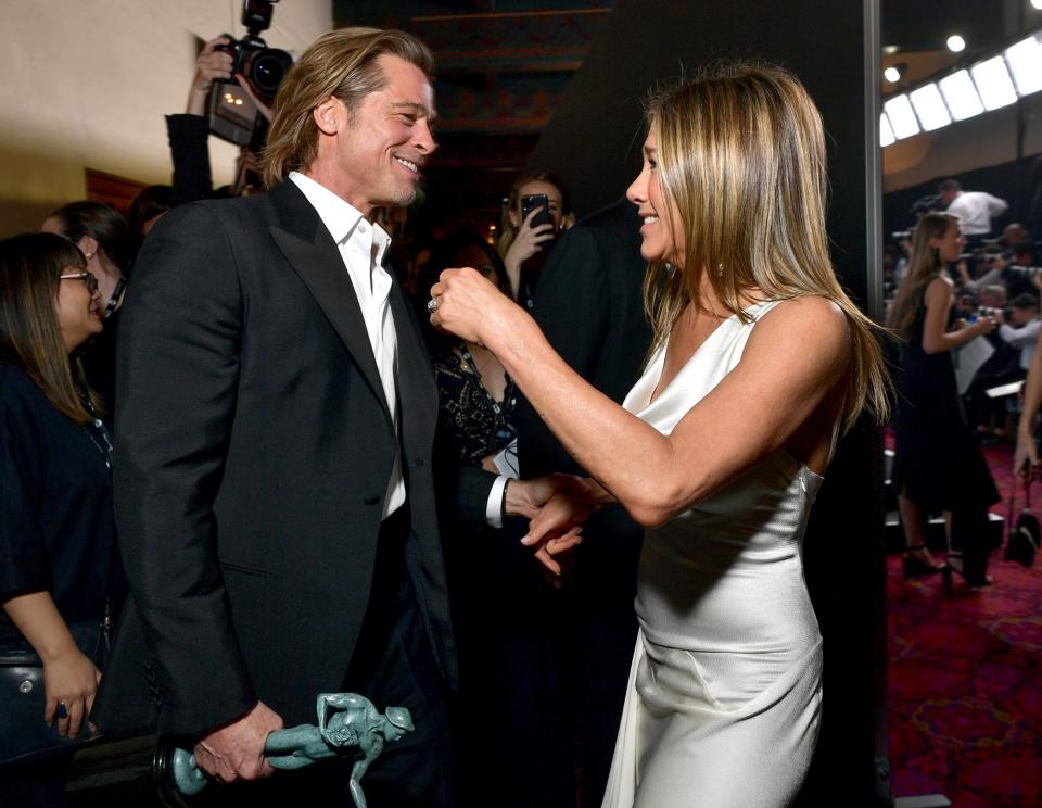 Brad Pitt and Jennifer Aniston sent the internet into a frenzy with their exuberant <a href="https://people.com/awards/sag-awards-2020-every-photo-of-jennifer-aniston-and-brad-pitt-together-at-the-awards/" rel="nofollow noopener" target="_blank" data-ylk="slk:reunion backstage;elm:context_link;itc:0;sec:content-canvas" class="link ">reunion backstage</a> after they each took home an award. 