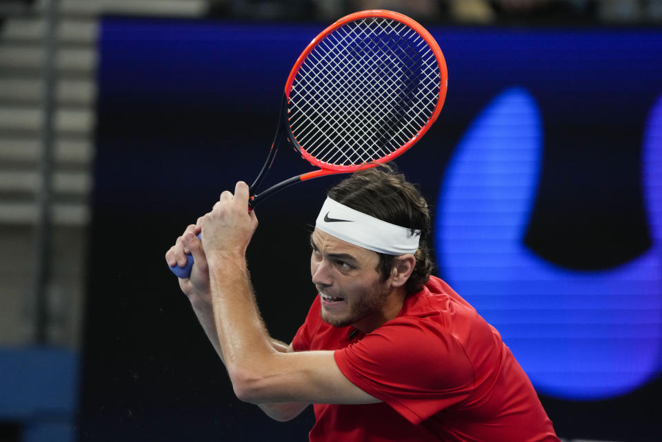 United States' Taylor Fritz plays a backhand return to Jiri Lehecka of the Czech Republic during their Group C match at the United Cup tennis event in Sydney, Australia, Thursday, Dec. 29, 2022. (AP Photo/Mark Baker)