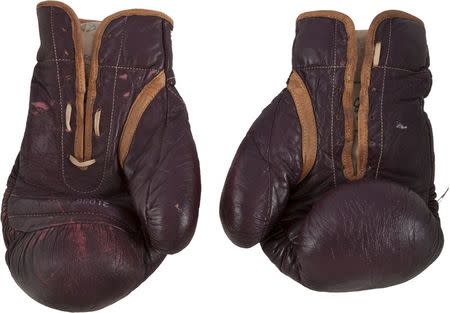 The 1971 Muhammad Ali gloves from his first Joe Frazier bout are pictured in this undated handout photo courtesy of Heritage Auctions, received July 31, 2014. REUTERS/Heritage Auctions/Handout via Reuters
