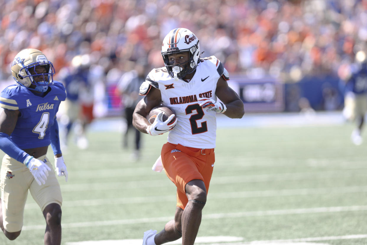 Oklahoma State wide receiver Talyn Shettron (2) scores on a 78-yard touchdown reception against Tulsa during the first half of an NCAA college football game, Saturday, Sept. 14, 2024, in Tulsa, Okla. (AP Photo/Joey Johnson)