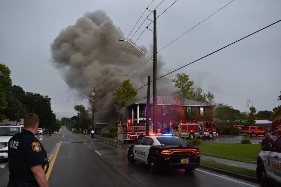 The DeFuniak Springs police and Walton County sheriff's deputies off a stretch of U.S. Highway 90 in DeFuniak Springs after a law firm caught fire Thursday afternoon.