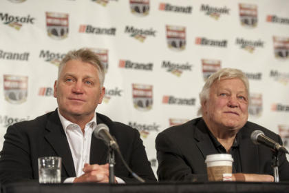 Brett Hull, left, and his father Bobby Hull speak during a media event before a tribute to Gordie Howe in Saskatoon, Saskatchewan, Friday, Feb. 6, 2015. (AP Photo/The Canadian Press, Liam Richards)