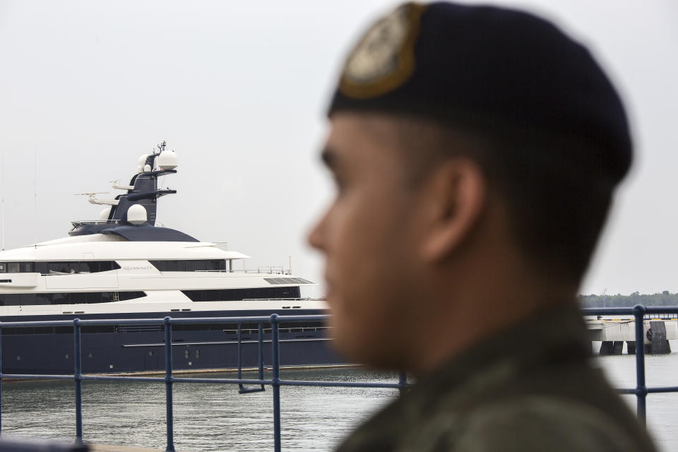 A police personnel stands guard over Equanimity, the US$250 million luxury yacht that fugitive Malaysian businessman Low Taek Jho allegedly bought with funds embezzled from 1Malaysia Development Berhad (1MDB) at Port Klangâs Boustead Cruise Terminal on August 8, 2018 in SELANGOR, Malaysia. (Photo by Ore Huiying/Getty Images)