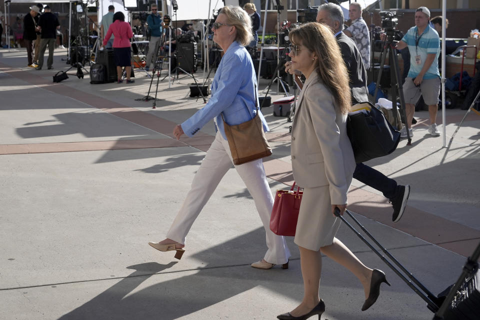 Prosecutors Kari Morrissey, left, and Erlinda Ocampo Johnson, right, arrive for jury selection in Actor Alec Baldwin's involuntary manslaughter trial, Tuesday, July 9, 2024, in Santa Fe, N.M. (AP Photo/Ross D. Franklin)