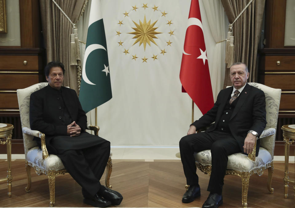 Turkey's President Recep Tayyip Erdogan, right, and Pakistan's Prime Minister Imran Khan pose for the media before a meeting, in Ankara, Turkey, Friday, Jan. 4, 2019. The two expected to discuss bilateral and regional issues. (Presidential Press Service via AP, Pool)