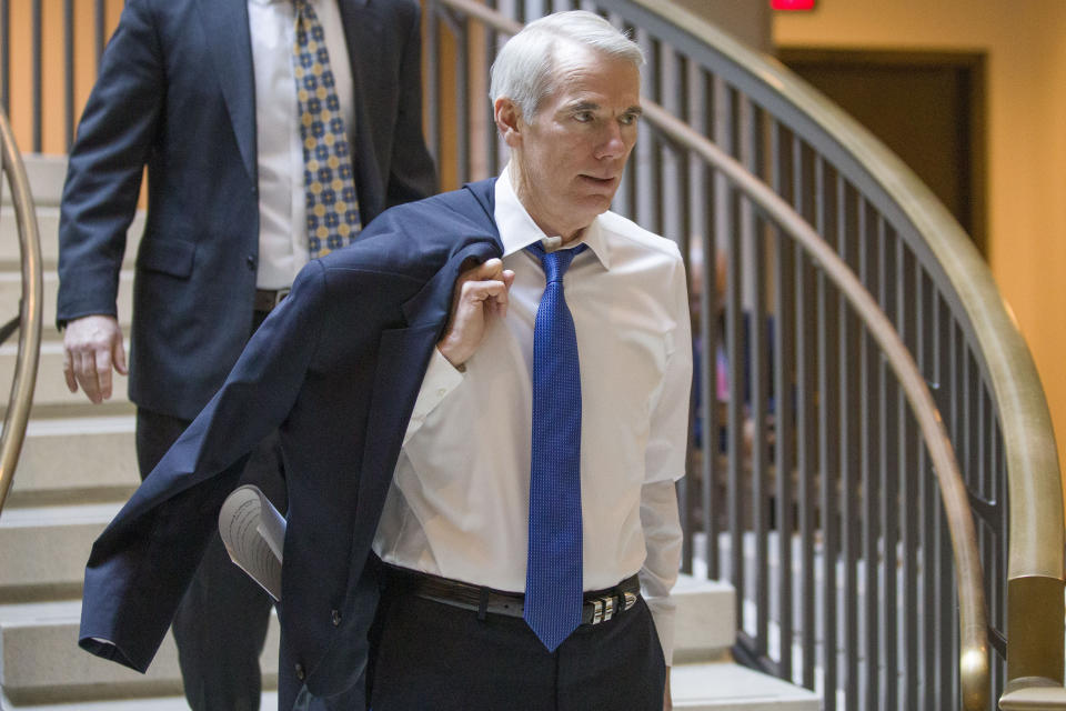 Sen. Rob Portman, R-Ohio, arrives for a closed-door briefing for the members of the Senate Foreign Relations Committee, Tuesday, March 5, 2019, in Washington. (AP Photo/Alex Brandon)