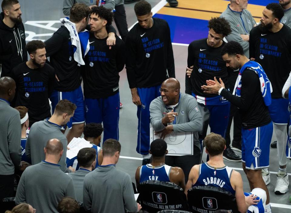 Sacramento Kings coach Mike Brown talks to his players during a time out in an NBA in-season tournament quarterfinal game Dec. 4, 2023, at Golden 1 Center.