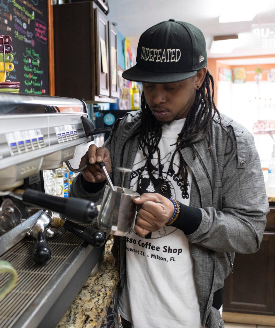 Chris Baker, the co-owner of Mama Lattes in Milton, fills a drink order on Friday, Feb. 10, 2023. Mama Lattes has operated in the Milton area for seven years.