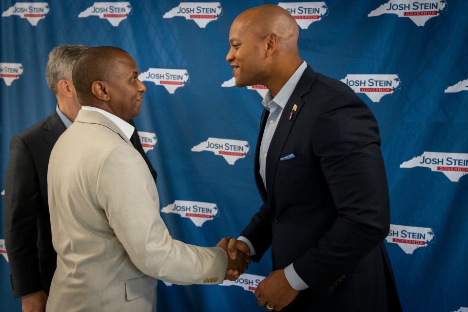 Maryland Governor and U.S. Army veteran Wes Moore (right), shakes hands with supporter and Olaf El (left), a 37-year-old public utilities worker from Lilington, NC, after the launch of North Carolina attorney general and gubernatorial hopeful Josh Stein’s “Veterans for Stein” campaign at the Retired Military Association in Fayetteville, NC, on Tuesday, June 11, 2024.