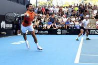 Serbia's Novak Djokovic and Canada's Vasek Pospisil plays a return shot during their doubles match against Tomislav Brkic of Bosnia and Ecuador's Gonzalo Escobar during their Round of 32 match at the Adelaide International Tennis tournament in Adelaide, Australia, Monday, Jan. 2, 2023. (AP Photo/Kelly Barnes)