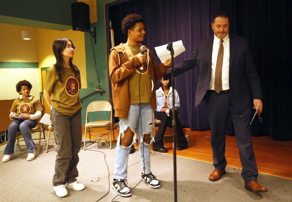 From left, Alina Nguyen, Danzel Desronvil and Michael Thomas, superintendent of Brockton Public Schools, during a public forum for student-led change to meals at Brockton Public Schools at the Plouffe Middle School on Wednesday, March 1, 2023.