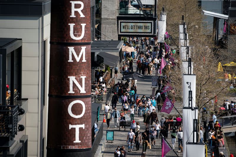 People gather at the Wharf neighborhood in Washington