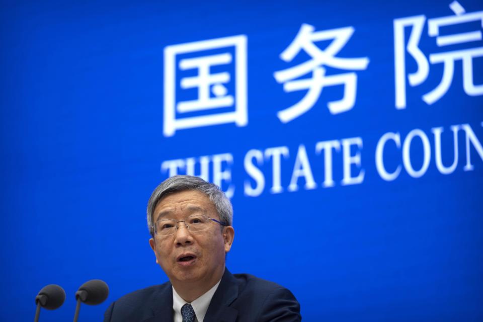 Yi Gang, governor of the People's Bank of China, speaks during a press conference at the State Council Information Office in Beijing, Friday, March 3, 2023. China's vast real estate industry is recovering from a slump triggered by tighter debt controls, a deputy central bank governor said Friday, after defaults by developers rattled global financial markets. (AP Photo/Mark Schiefelbein)