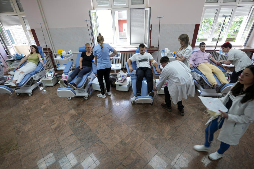 People donate blood for mass shooting victims in Belgrade, Serbia, Friday, May 5, 2023. The bloodshed sent shockwaves through a Balkan nation scarred by wars, but unused to mass murders. (AP Photo/Darko Vojinovic)