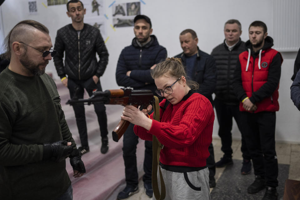 Ukrainian civilians receive weapons training in Lviv, Western Ukraine, Saturday, March 19, 2022. Fighting raged on multiple fronts in Ukraine more than three weeks after Russia's Feb. 24 invasion. U.N. bodies have confirmed more than 800 civilian deaths since the war began but say the real toll is considerably higher. The U.N. says more than 3.3 million people have fled Ukraine as refugees. (AP Photo/Bernat Armangue)