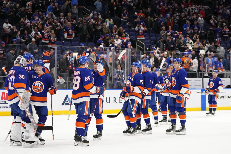 New York Islanders goaltender Ilya Sorokin (30) celebrates with teammates after an NHL hockey game against the New Jersey Devils Monday, March 27, 2023, in Elmont, N.Y. The Islanders won 5-1. (AP Photo/Frank Franklin II)