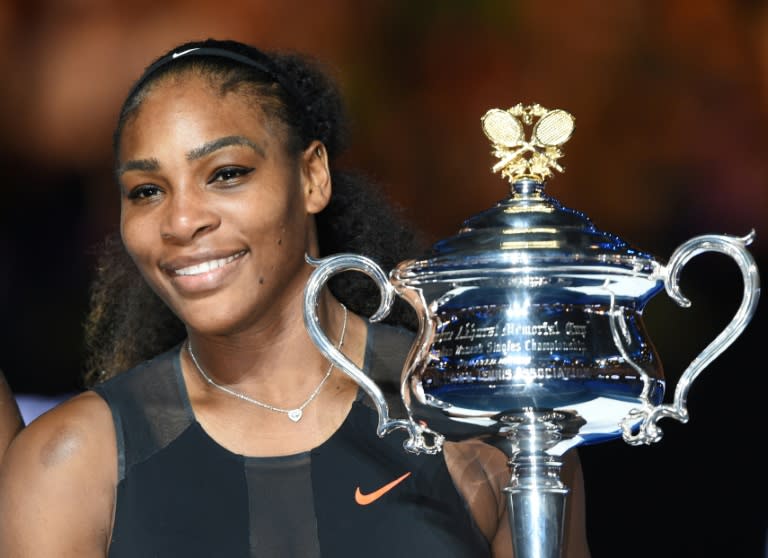 Serena Williams holds the trophy following her victory over sister Venus in the Australian Open final, in Melbourne, on January 28, 2017