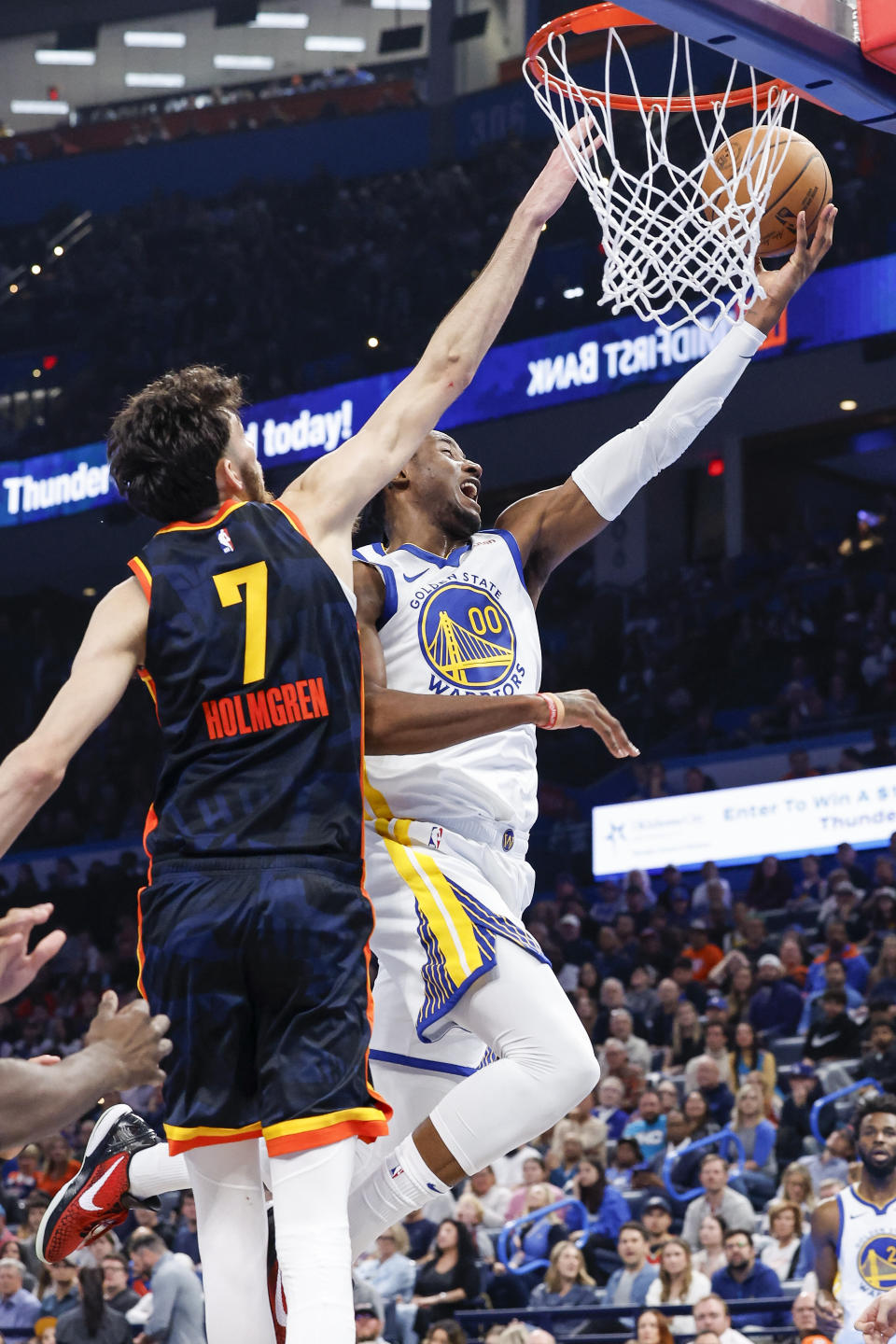 Nov 3, 2023; Oklahoma City, Oklahoma, USA; Golden State Warriors forward <a class="link " href="https://sports.yahoo.com/nba/players/6549" data-i13n="sec:content-canvas;subsec:anchor_text;elm:context_link" data-ylk="slk:Jonathan Kuminga;sec:content-canvas;subsec:anchor_text;elm:context_link;itc:0">Jonathan Kuminga</a> (00) goes up for a shot against Oklahoma City Thunder forward Chet Holmgren (7) during the second half at Paycom Center. Mandatory Credit: Alonzo Adams-USA TODAY Sports