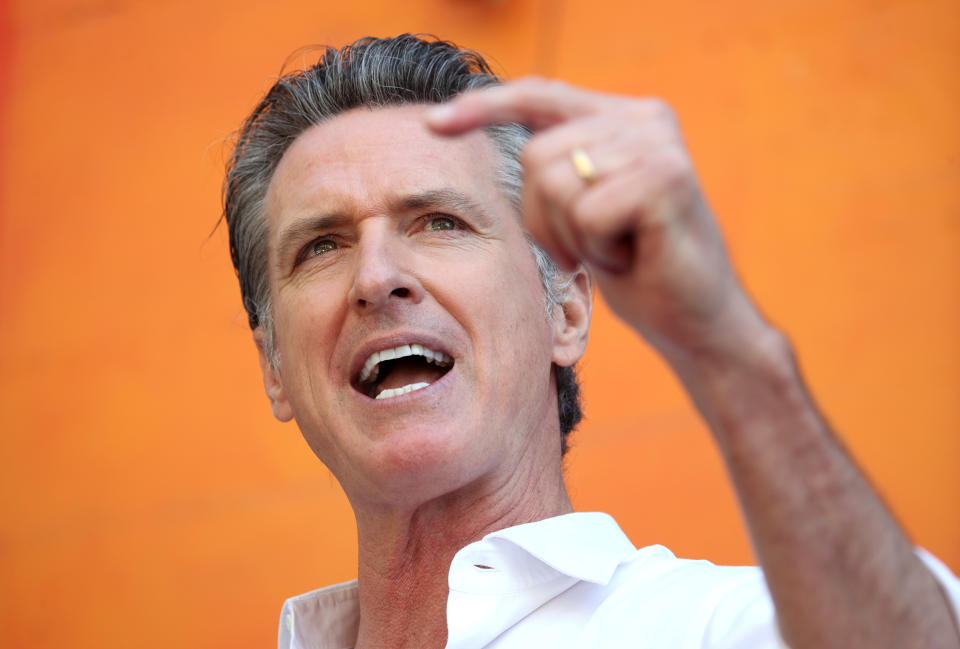 California Gov. Gavin Newsom gestures during a speech.