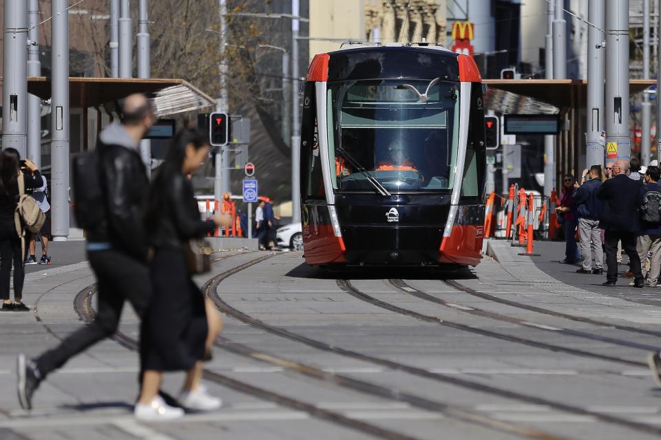 Pedestrians are being fined for crossing light rail tracks in the wrong place. Source: AAP