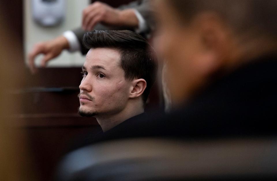Michael Mosley sits in court while a witness testifies during his trial at Justice A. A. Birch Building in Nashville , Tenn., Tuesday, March 29, 2022. Mosley was charged with two counts of first-degree murder and one each of attempted first-degree murder and assault in connection to a fatal 2019 stabbing at a midtown bar.