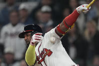 Atlanta Braves designated hitter Marcell Ozuna (20) fouls a ball off his arm as he bats in the seventh inning of a baseball game against the Arizona Diamondbacks Saturday, April 6, 2024, in Atlanta. (AP Photo/John Bazemore)