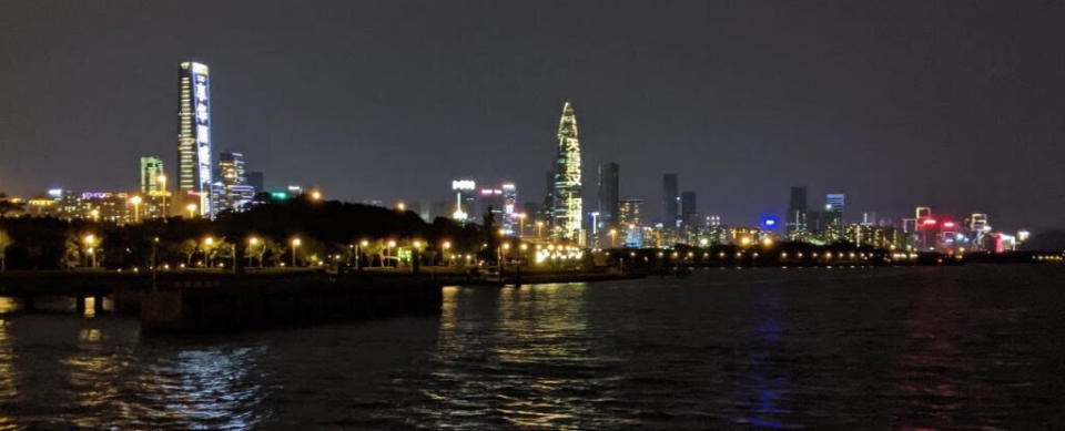 The Shenzhen skyline at night. The building in the center has projected text that reads &ldquo;天佑武汉" (God bless Wuhan). (Photo: Courtesy of Peter Xu)
