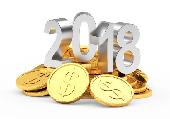 Silver 2018 numerals on top of gold coins.