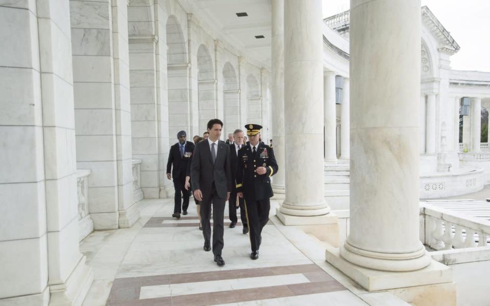 Prime Minister Justin Trudeau and Maj. Gen. Bradley Becker walk in the Memorial Theatre at the Arlington Cemetery Friday, March 11, 2016 in Arlington, Virginia. THE CANADIAN PRESS/Paul Chiasson