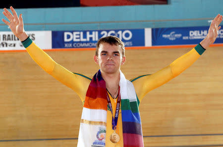 FILE PHOTO - Jack Bobridge of Australia celebrates after winning the gold medal in the men's Individual Pursuit finals during the Commonwealth Games in New Delhi October 5, 2010. REUTERS/Suzanne Plunkett/File photo