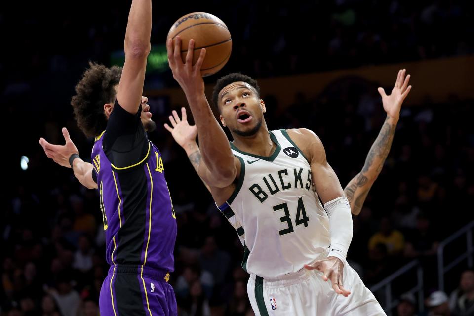 Bucks forward Giannis Antetokounmpo gets ready to put up a shot against Lakers center Jaxson Hayes during the first half Friday night at Crypto.com Arena.