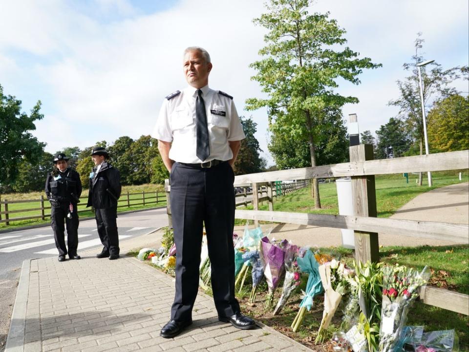 Chief Superintendent Trevor Lawry beside floral tributes to  Sabina Nessa (PA)