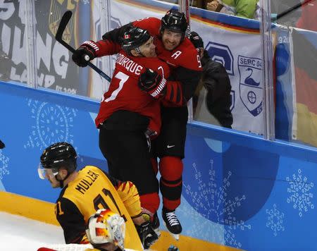 Ice Hockey - Pyeongchang 2018 Winter Olympics - Men Semifinal Match - Canada v Germany - Gangneung Hockey Centre, Gangneung, South Korea - February 23, 2018 - Canada's Derek Roy celebrates a goal with Canada's Rene Bourque. REUTERS/Grigory Dukor