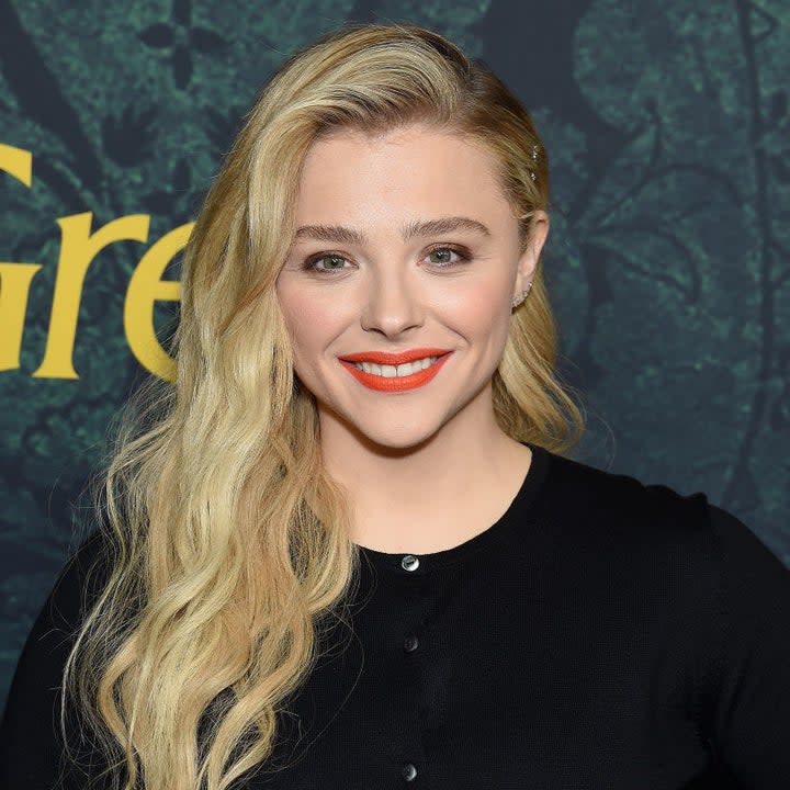 Chloë Grace Moretz posing on a red carpet