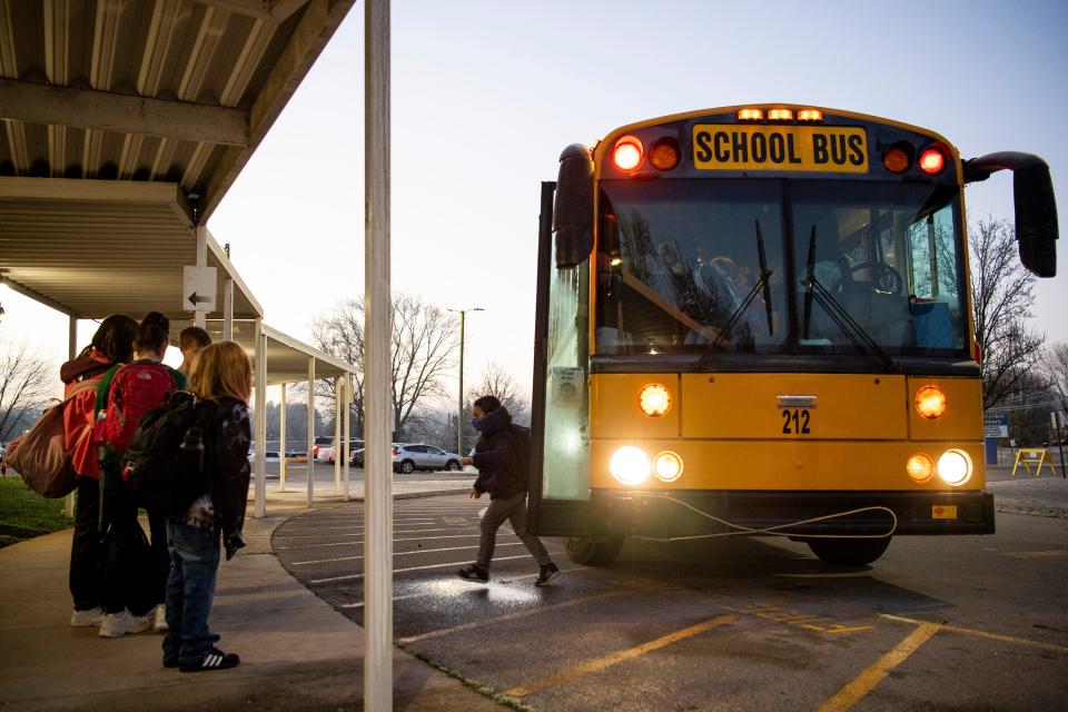 Schoolchildren arrive by bus for the first day of school after the winter holidays at Sunnyview Primary School in Knoxville on Tuesday, Jan. 4, 2022. 