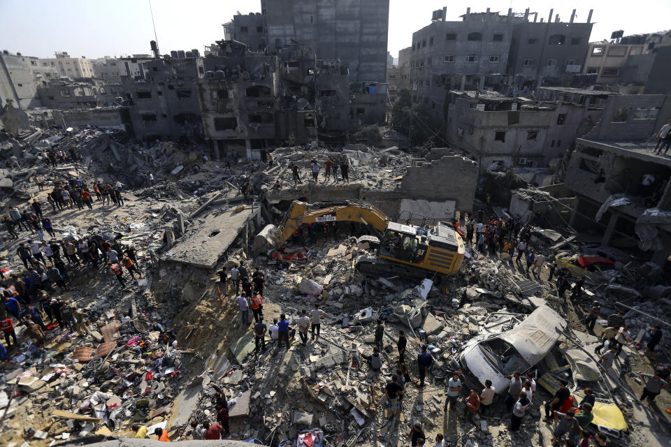 FILE - Palestinians look for survivors under the rubble of destroyed buildings following Israeli airstrikes in Jabaliya refugee camp, northern Gaza Strip, Wednesday, Nov. 1, 2023. Israel's military offensive has turned much of northern Gaza into an uninhabitable moonscape. When the war ends, any relief will quickly be overshadowed by the dread of displaced families for their future. (AP Photo/Abed Khaled, File)