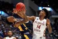 <p>Ja Morant #12 of the Murray State Racers and Terance Mann #14 of the Florida State Seminoles battle for the ball in the second half during the second round of the 2019 NCAA Men’s Basketball Tournament at XL Center on March 23, 2019 in Hartford, Connecticut. (Photo by Maddie Meyer/Getty Images) </p>