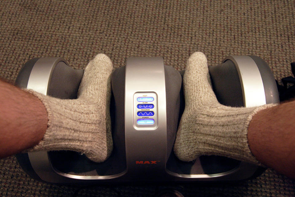 a person's feet in a foot massager