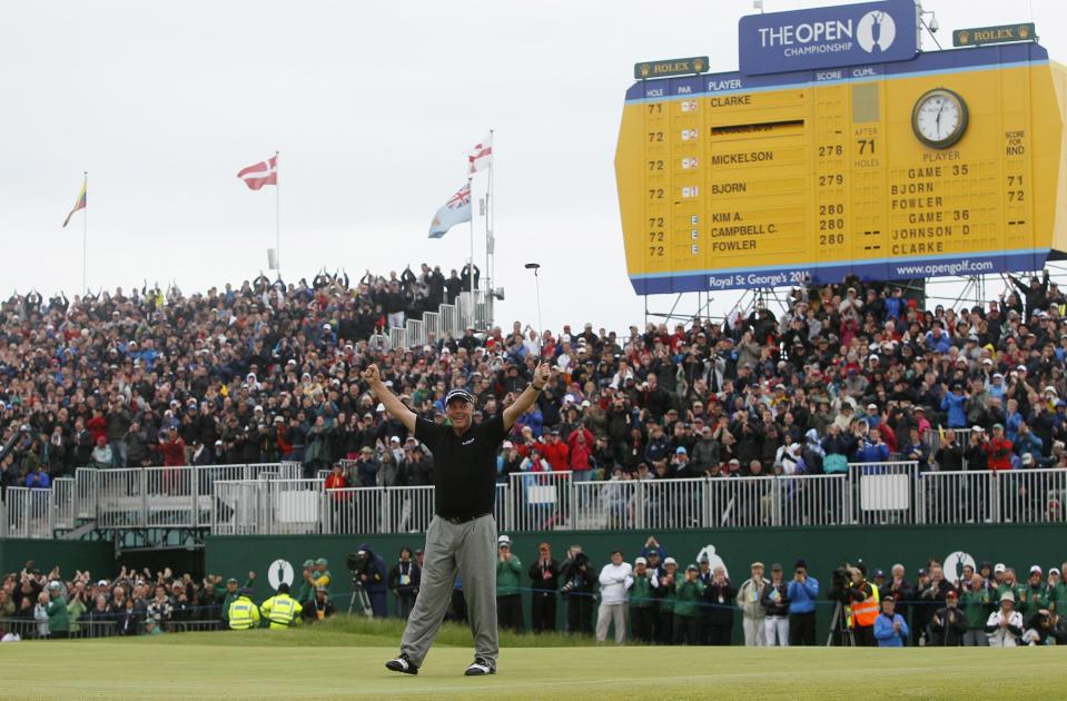 FILE - Northern Ireland's Darren Clarke reacts on the 18th green after winning the British Open Golf Championship at Royal St George's golf course in Sandwich, England, in this Sunday, July 17, 2011, file photo. The British Open, canceled last year by the pandemic, returns to Royal St. George's this year. (AP Photo/Jon Super, File)