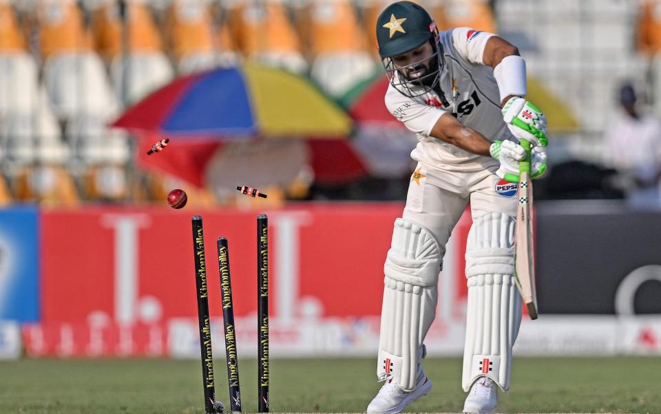 Pakistan's Mohammad Rizwan is clean bowled by England's Brydon Carse during the fourth day of the first Test cricket match between Pakistan and England at the Multan Cricket Stadium in Multan on October 10, 2024