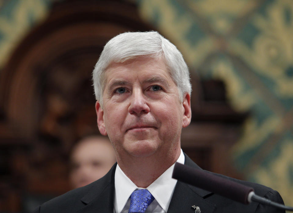 FILE - In this Jan. 23, 2018, file photo Michigan Gov. Rick Snyder delivers his State of the State address to a joint session of the House and Senate at the state Capitol in Lansing, Mich. Former Michigan governor Snyder backed Joe Biden for president on Thursday, Sept. 3, 2020, becoming the latest high-profile Republican to support the Democratic nominee over President Donald Trump. (AP Photo/Al Goldis, File)