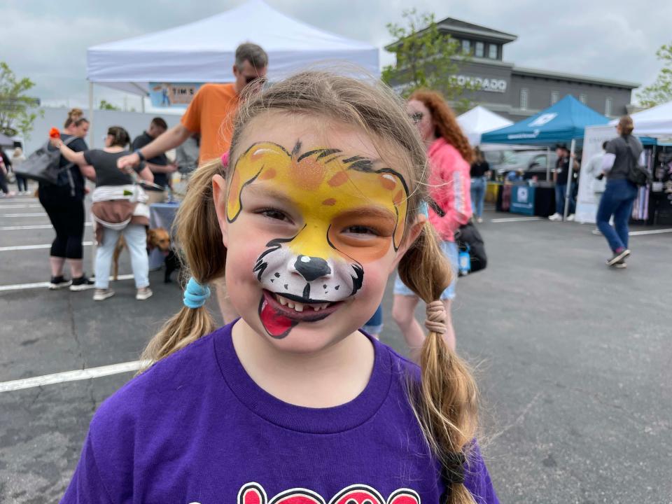 Kennedy Sterling has fun with a puppy-painted face.