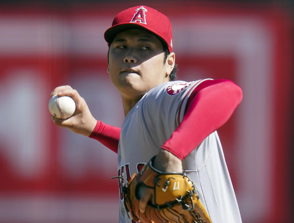FILE - Los Angeles Angels' Shohei Ohtani pitches against the Oakland Athletics during the first inning of a baseball game in Oakland, Calif., Oct. 5, 2022. Ohtani’s long-term future with the Angels is up in the air as he heads into the final season of his contract. But the two-way superstar’s plans for the spring are all set. (AP Photo/Godofredo A. Vásquez, File)