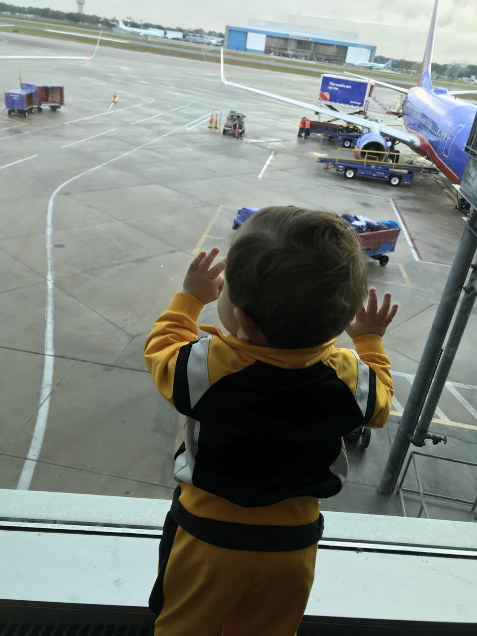 Karen Buono Johnson's 13-month-old son, looking out an airport window at all the Southwest Airlines planes not flying.  (Courtesy Karen Buono Johnson)