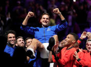 <p>Roger Federer gets a lift on Sept. 23 following his Laver Cup doubles match in London, the last competition of his professional career.</p>
