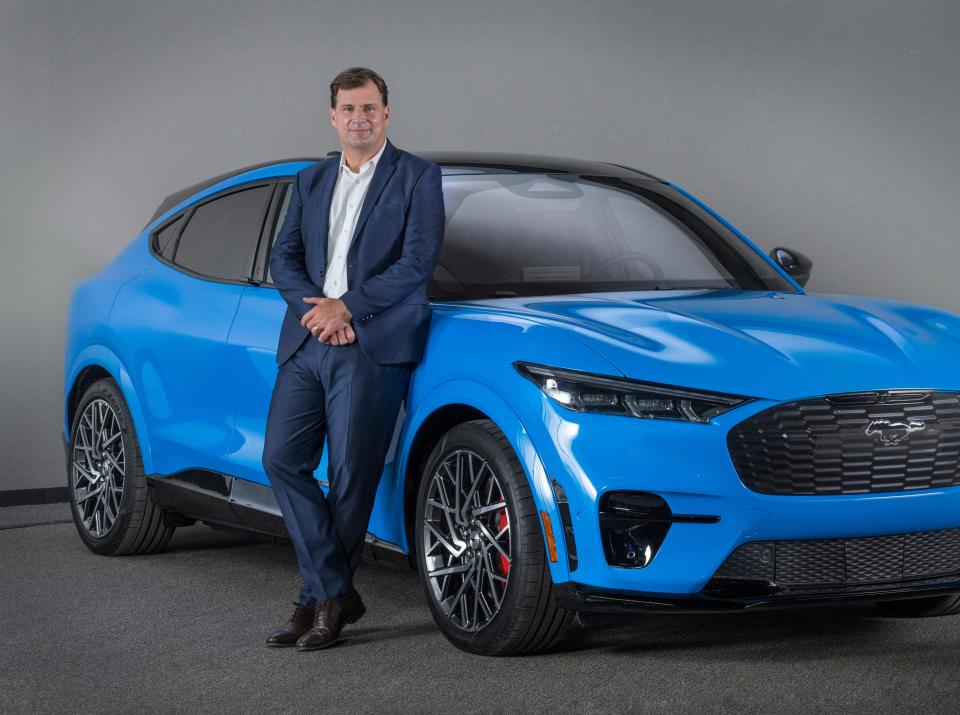 Ford CEO Jim Farley is standing with the 2021 all-electric Mustang Mach-E in Dearborn in September. This photo was taken during a video shoot to support the introduction of Mustang Mach-E in China at the 2020 Beijing Auto Show.