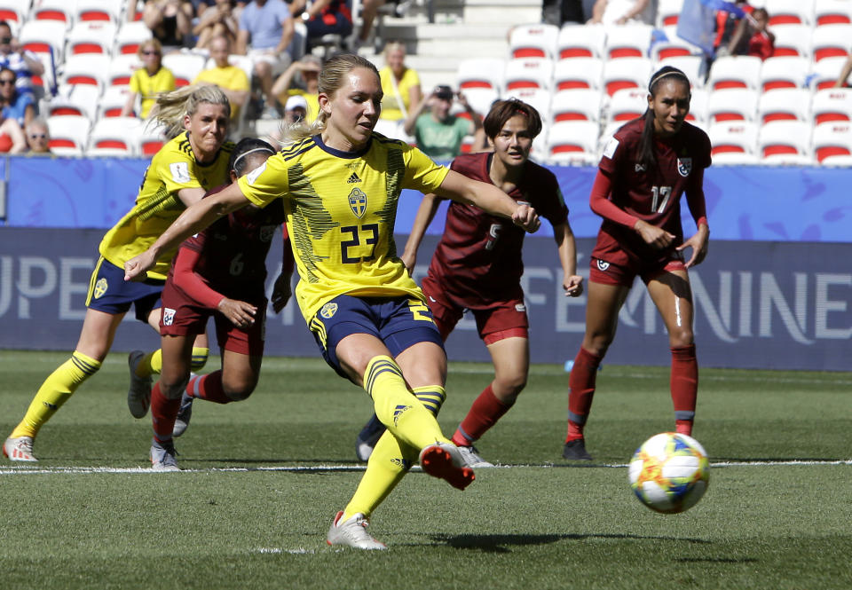 Sweden's Elin Rubensson scores her side's fifth goal by penalty during the Women's World Cup Group F soccer match between Sweden and Thailand at the Stade de Nice in Nice, France, Sunday, June 16, 2019. (AP Photo/Claude Paris)