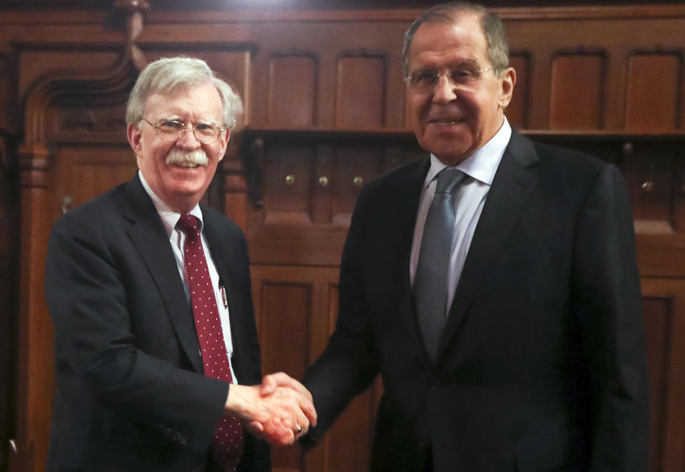 U.S. National Security Adviser John Bolton, left, and Russian Foreign Minister Sergey Lavrov shake hands prior to their talks in Moscow, Russia, Monday, Oct. 22, 2018. U.S. President Donald Trump's national security adviser has met with top Russian officials after Trump declared he intended to pull out of a 1987 nuclear weapons treaty. (Russian Foreign Ministry Press Service via AP)