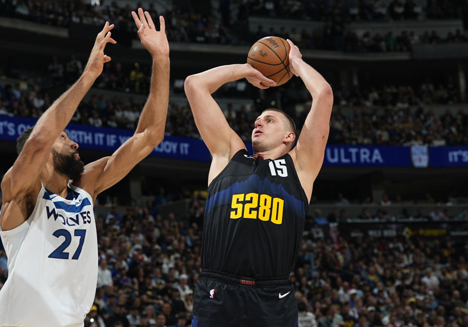 Denver Nuggets center Nikola Jokic shoots over Minnesota Timberwolves center Rudy Gobert during the first half of Game 5 of an NBA basketball second-round playoff series Tuesday, May 14, 2024, in Denver (AP Photo/David Zalubowski)