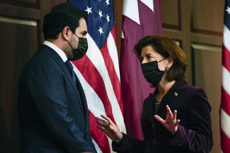 Qatar's Emir Sheikh Tamim bin Hamad Al Thani and Secretary of Commerce Gina Raimondo speak after Stan Deal, President and CEO Boeing Commercial Airplanes and Qatar Airways' CEO Akbar al-Baker signed an agreement for the purchase of thirty-four 777-8 Freighter planes with purchase rights for an additional sixteen, in the Eisenhower Executive Office Building on the White House Campus in Washington, Monday, Jan. 31, 2022. They also signed a letter of intent for an additional purchase from Qatar Airways of twenty-five 737-10s , worth $6.7 billion. (AP Photo/Carolyn Kaster)